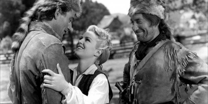 John Wayne and Claire Trevor embrace in Allegheny Uprising