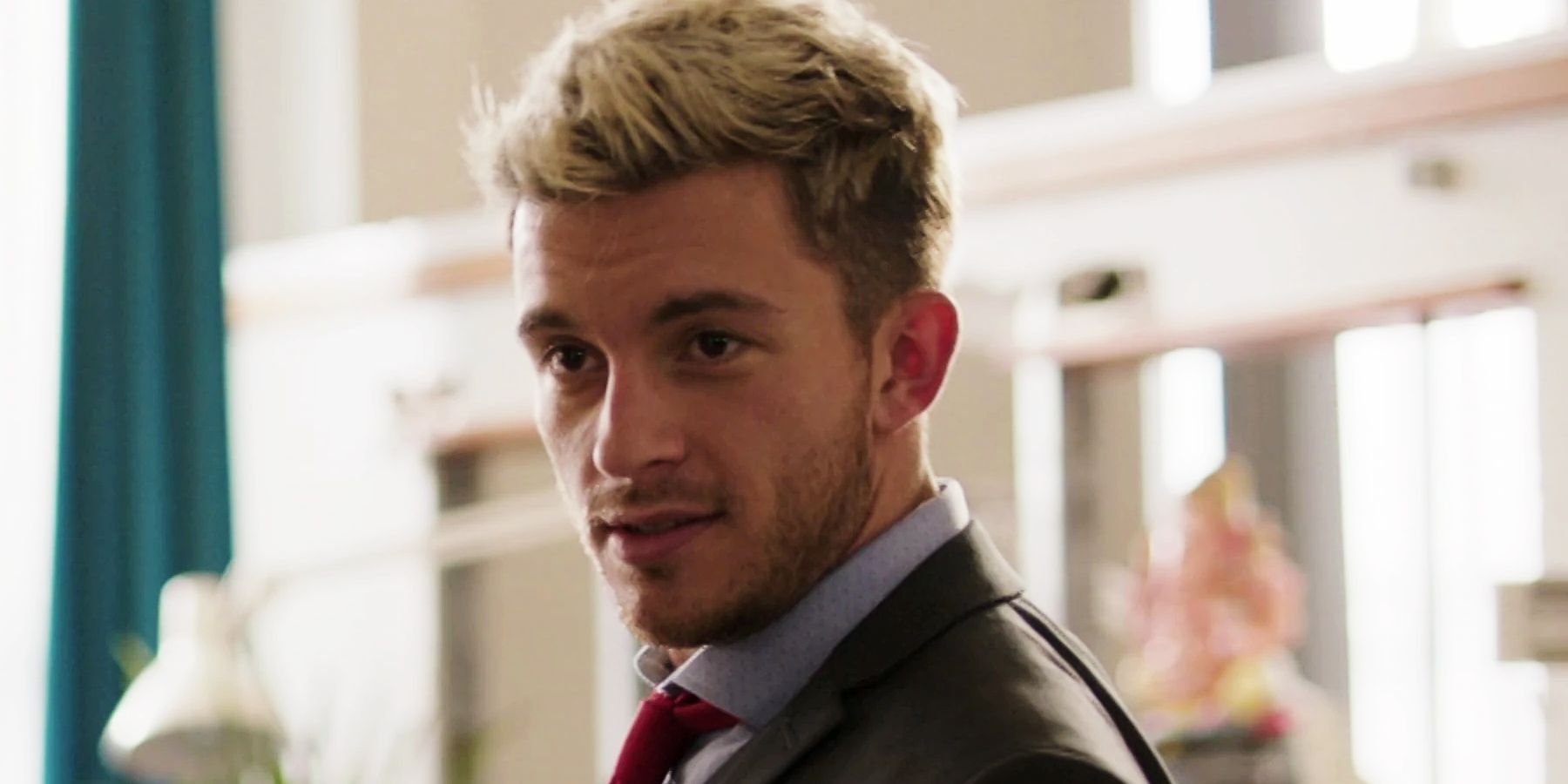 Sam, played by Jonathan Bailey, looks smug in Crashing