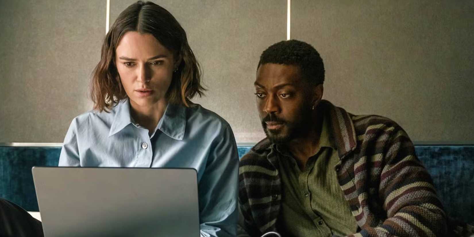 Keira Knightley is researching on her computer in The Woman in Cabin 10