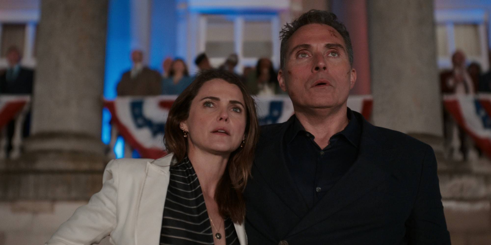 Keri_Russell_and_Rufus_Sewell_look_shocked_as_they_stare_out_of_frame_in_The_Diplomat_season_3_trailwr