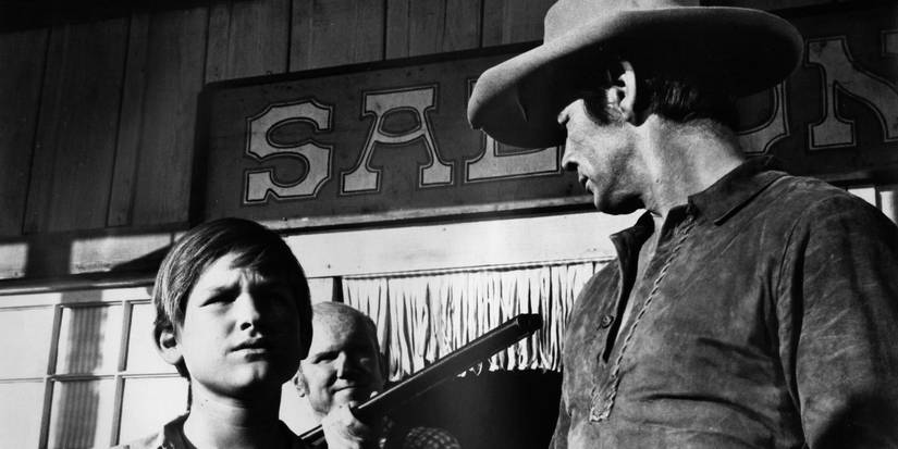 Kurt Russell and Charles Bronson at gunpoint in Guns of Diablo