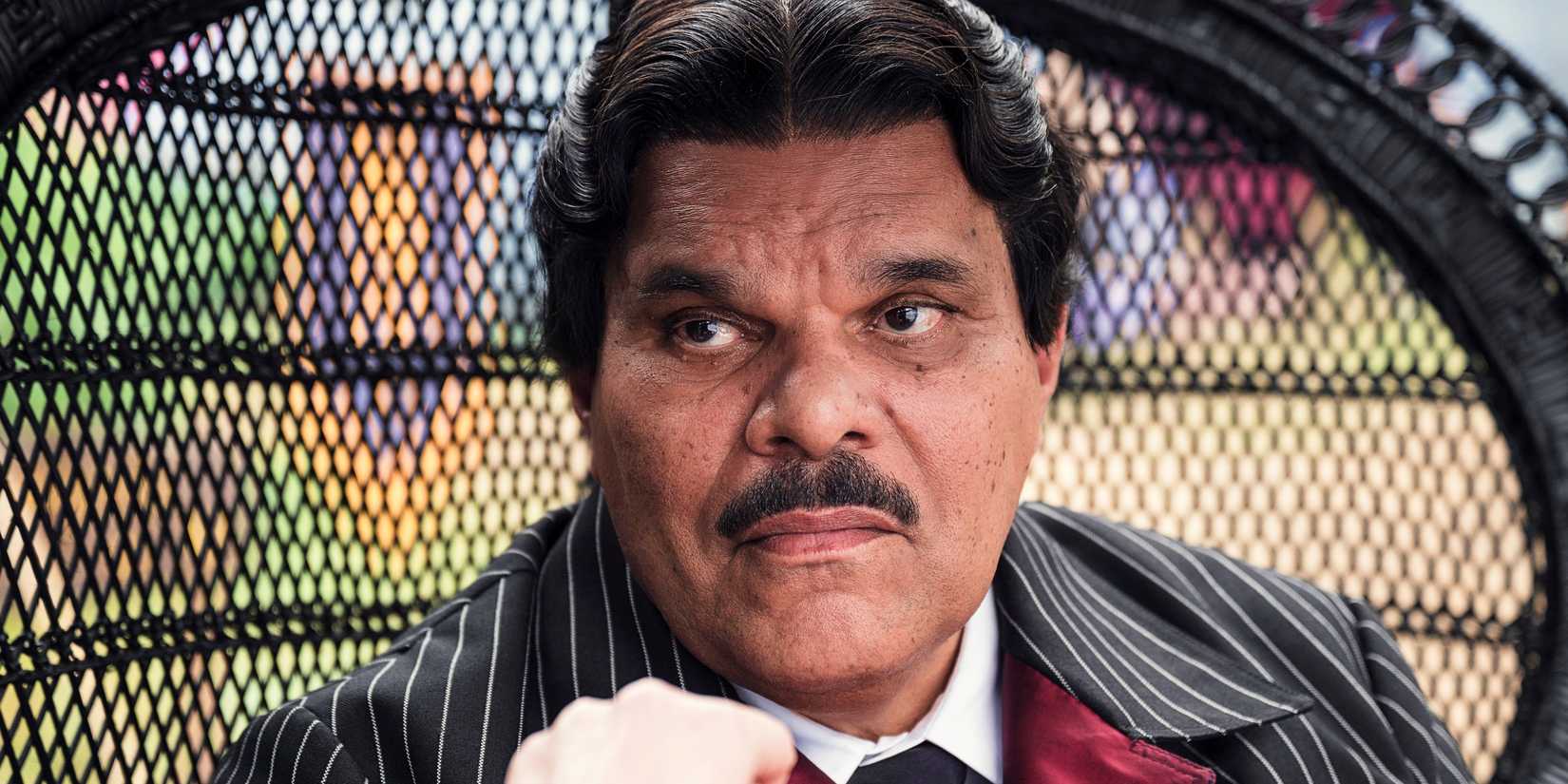 8 Actors Who Could Play Blackbeard In One Piece Live-Action Season 3 1 Luis Guzman as Gomez Addams about to kiss Morticia's hand in Wednesday season 2