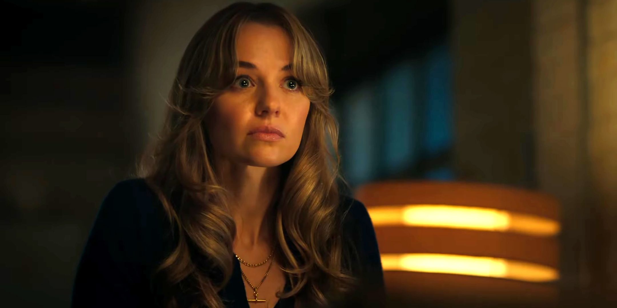 Madison Iseman as Sarah looking surprised and upset in The Rainmaker