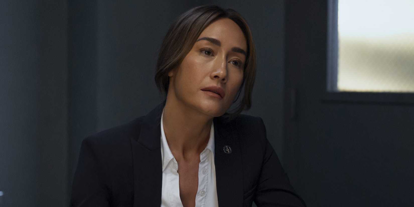 Maggie Q as Renee Ballard looking concerned in an episode of Ballard