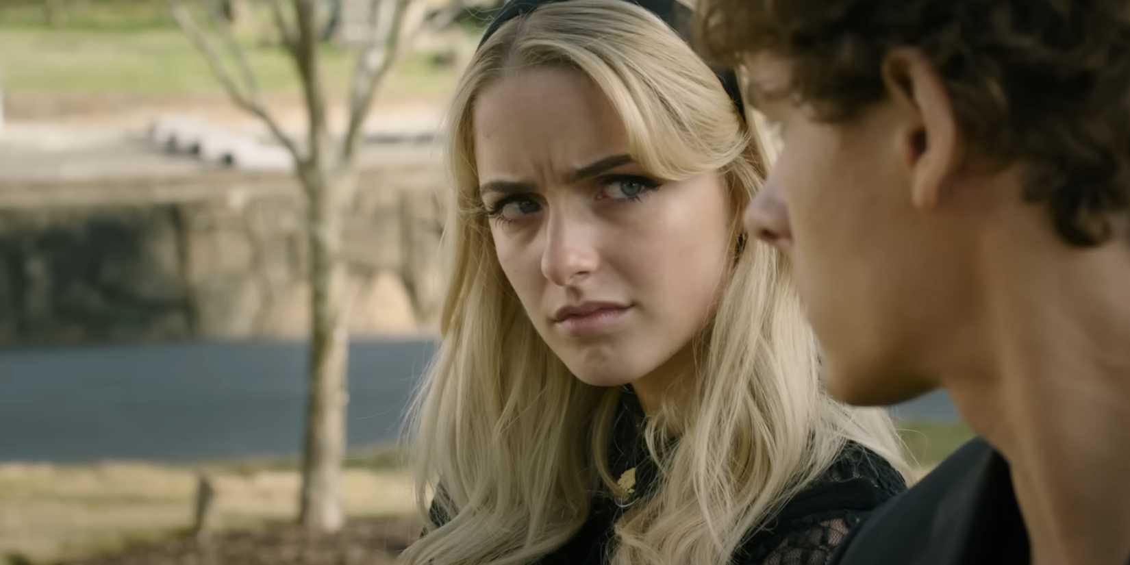 Mckenna grace looks over at Mason Thames in the trailer for Regretting You