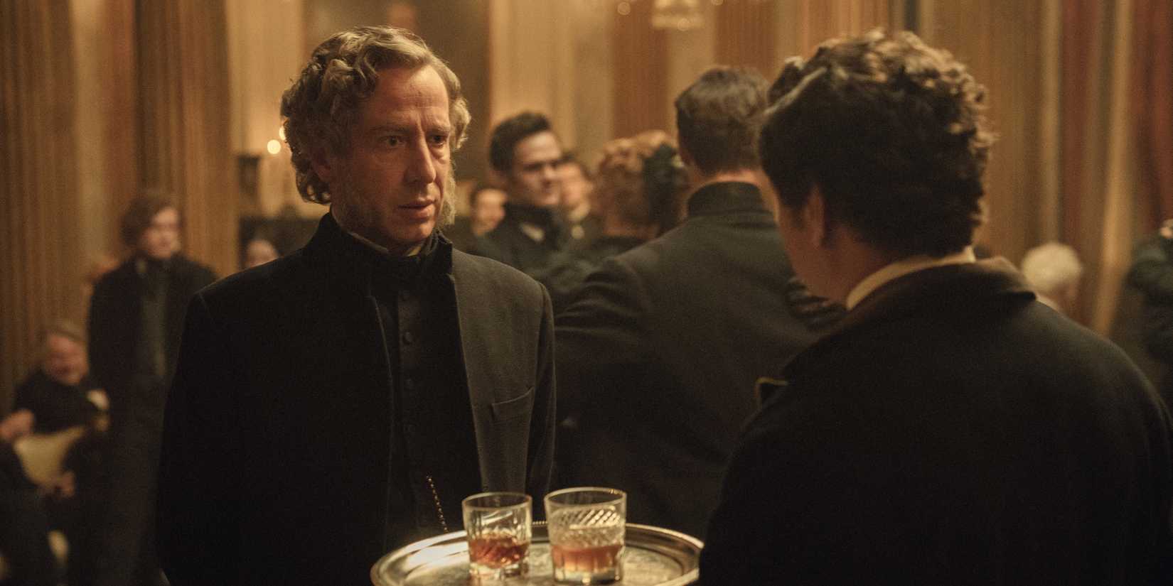 Michael Colgan looking at a waiter from House of Guinness