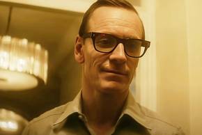 Michael Fassbender smirking in Black Bag