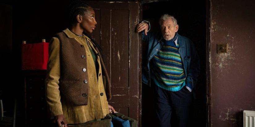 Michaela Coel looks at Ian McKellen, who stands in a doorway, in The Christophers