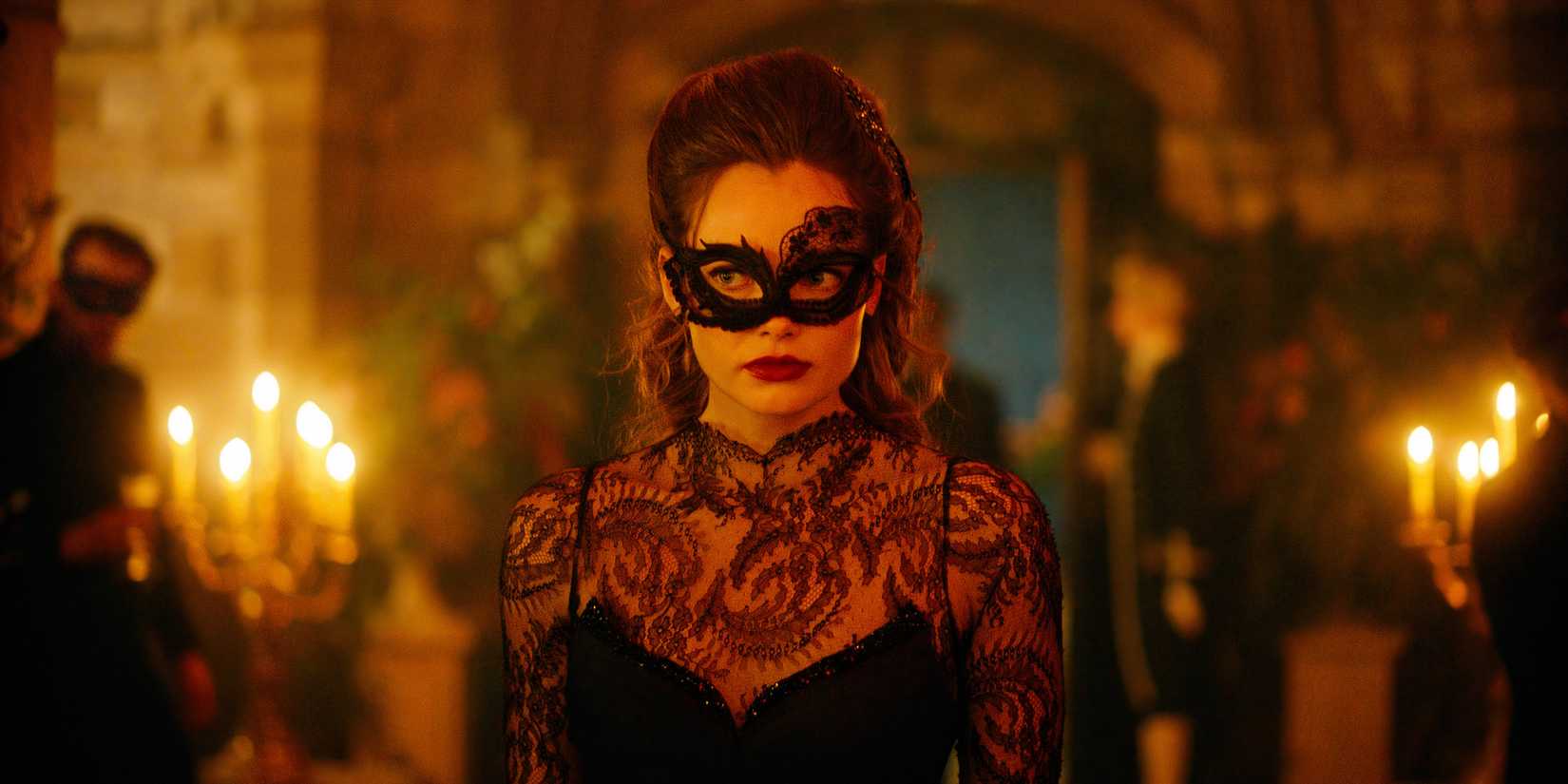 Nan wearing mask at the masquerade in The Buccaneers season 2 episode 8