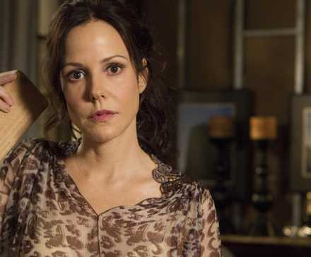 Nancy Botwin (Mary Louise Parker) holding a block of wood in Weeds