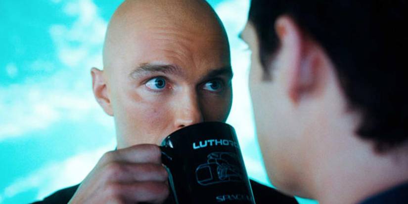 Nicholas Hoult as Lex Luthor drinks from his cup while Superman threatens him