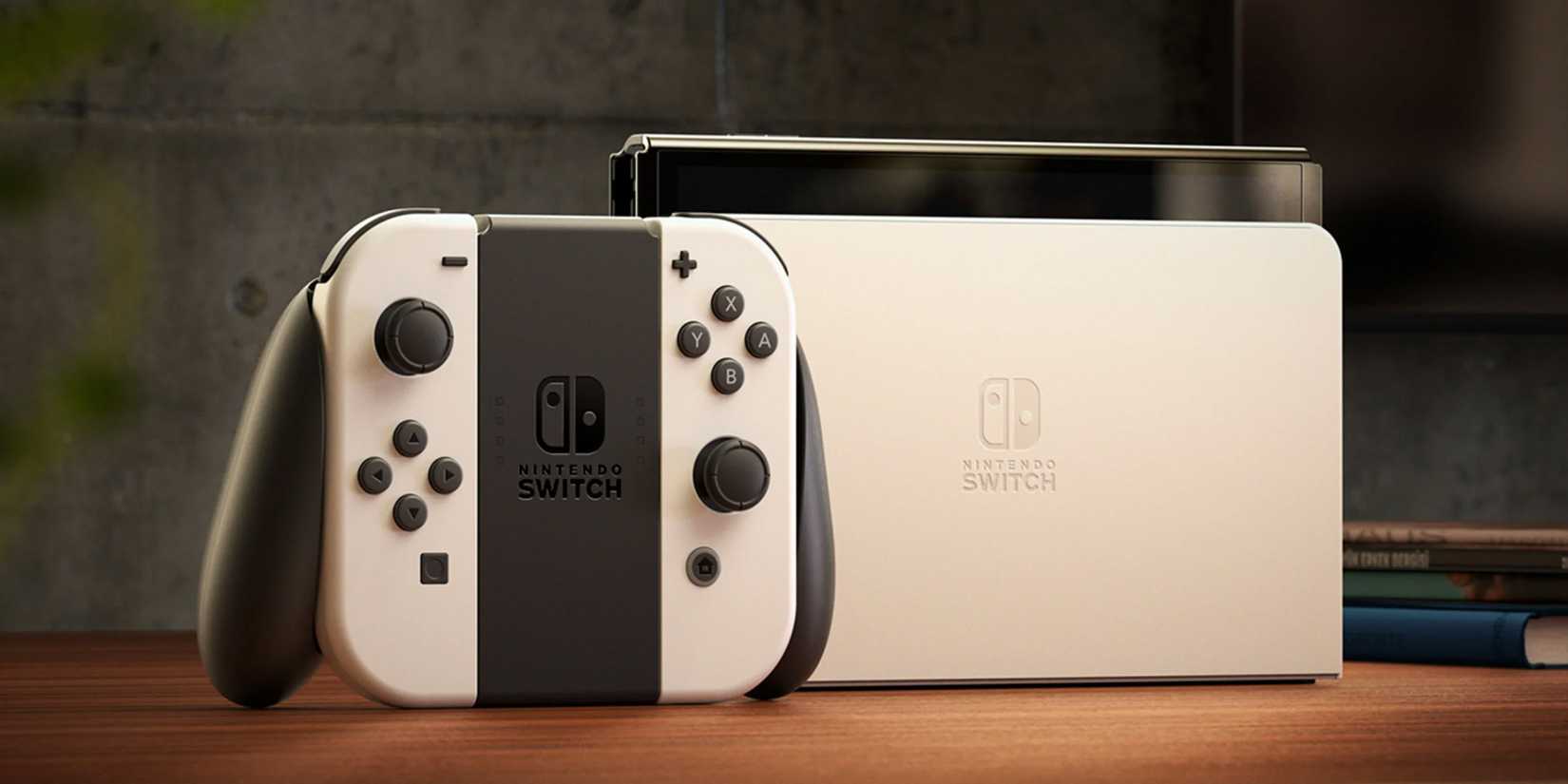 A white Nintendo Switch OLED next to a TV