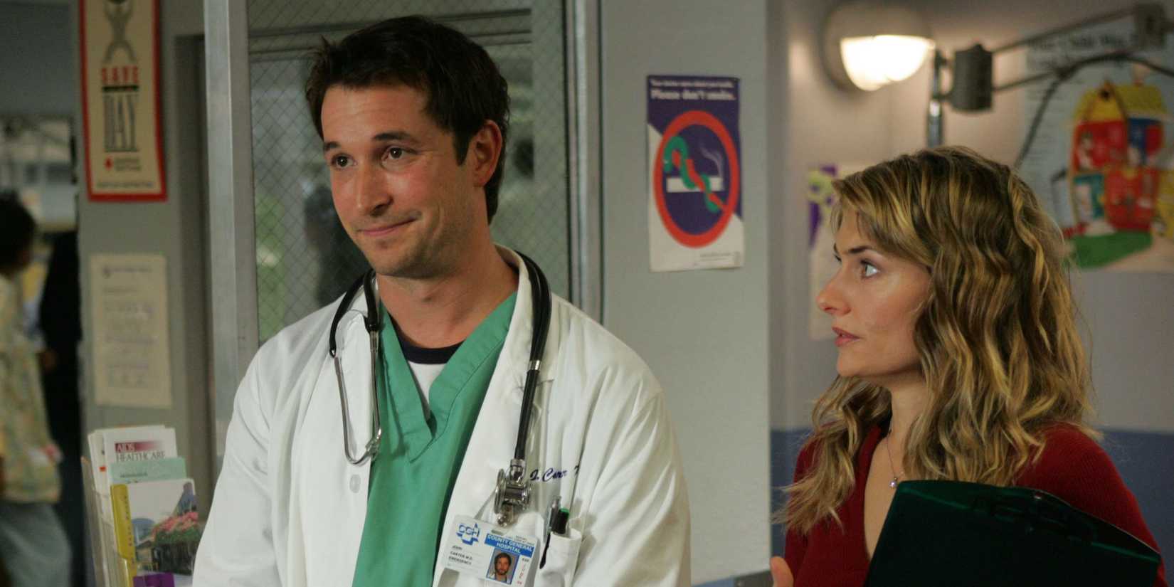 Noah Wyle as John Carter with a woman looking at him in ER