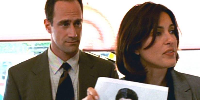 Olivia Benson and Elliot Stabler in Law & Order- SVU holding a poster looking serious