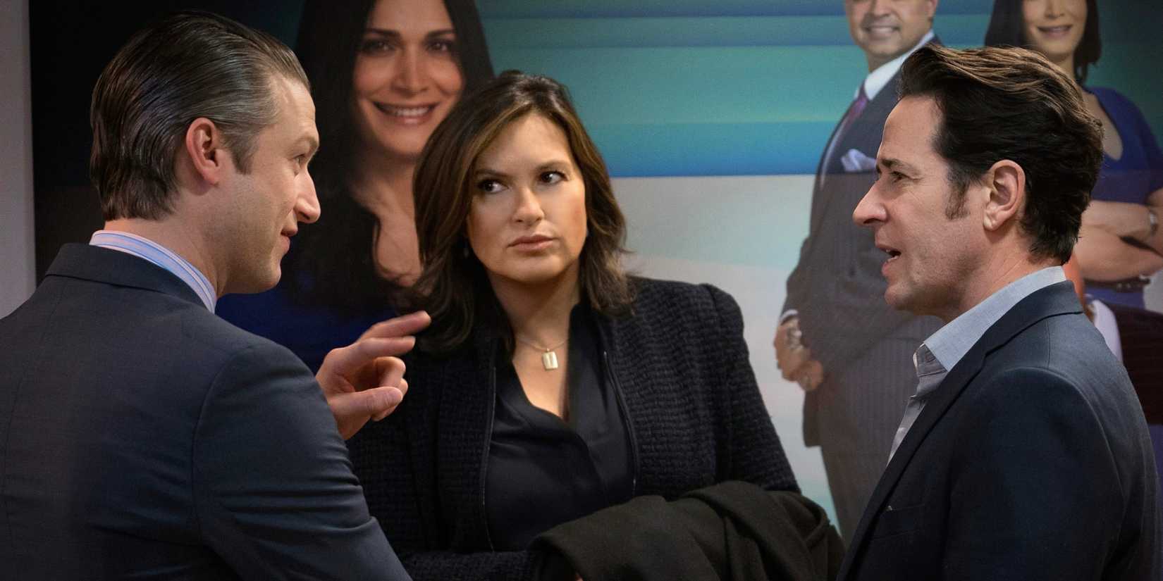 Olivia listening while the men in front of her talk in the SVU episode "Hunting Party"