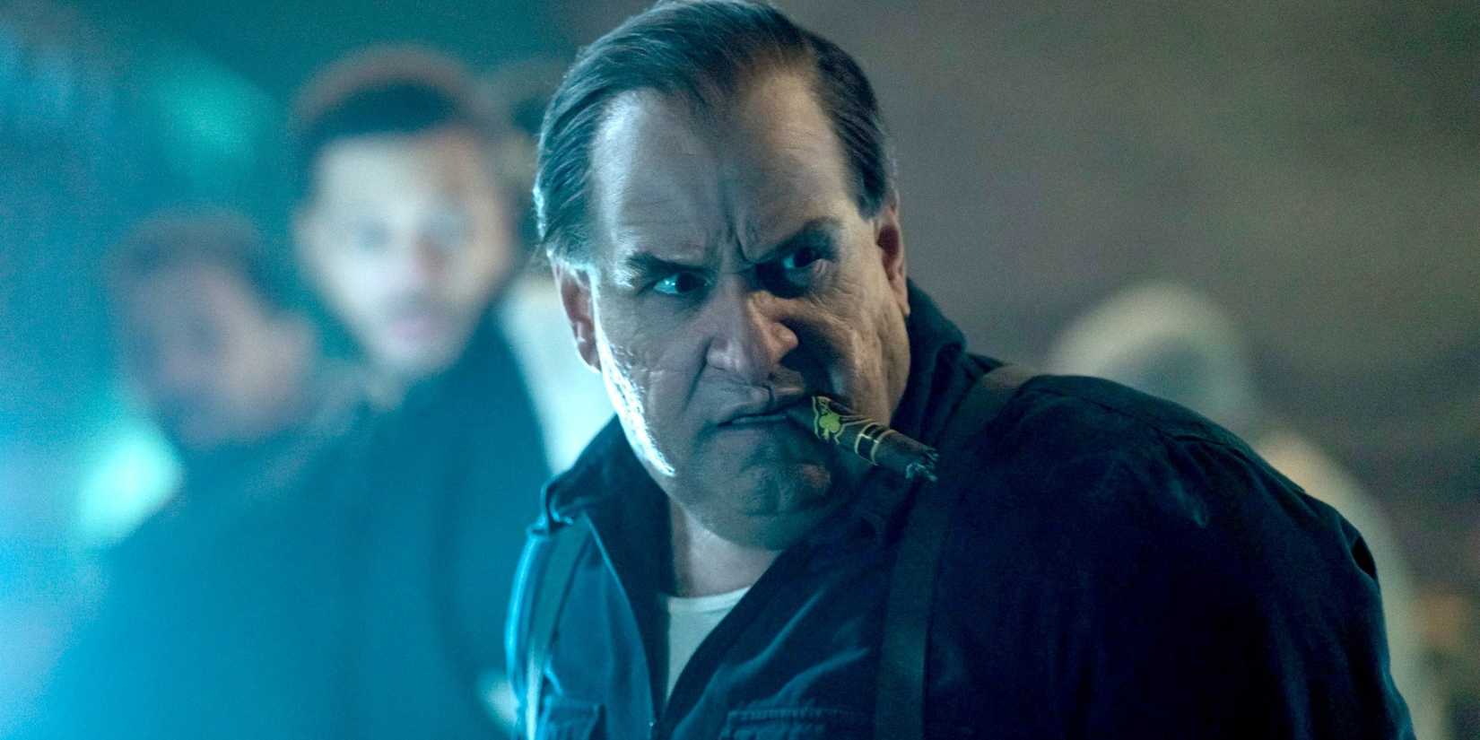 Oz holds a cigar in his mouth while looking shocked in The Penguin