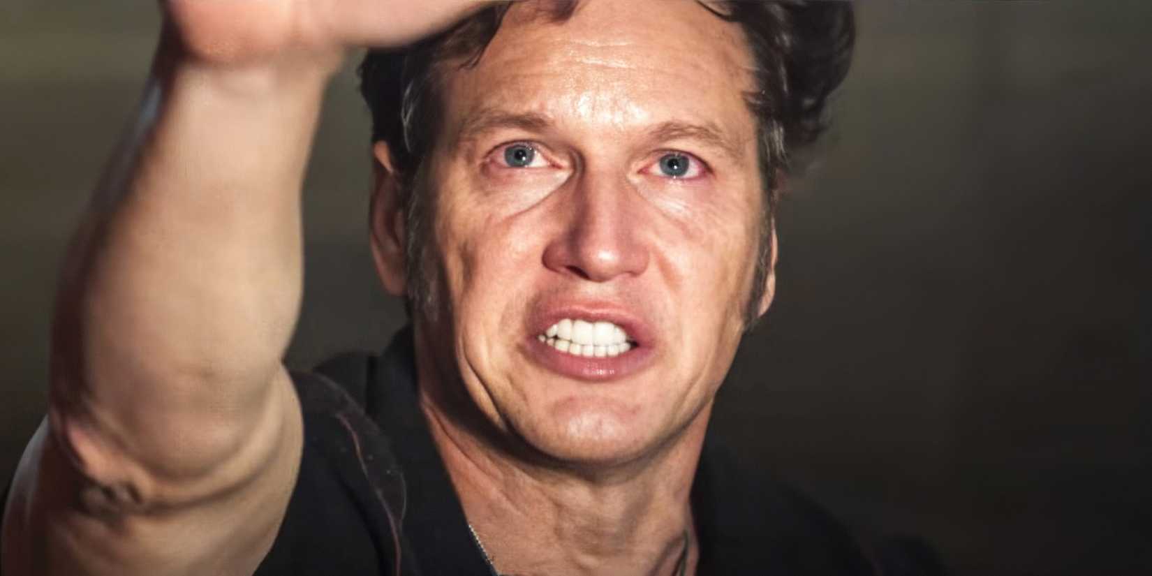 Patrick Wilson as Ed Warren holding his hound out in The Conjuring Last Rites