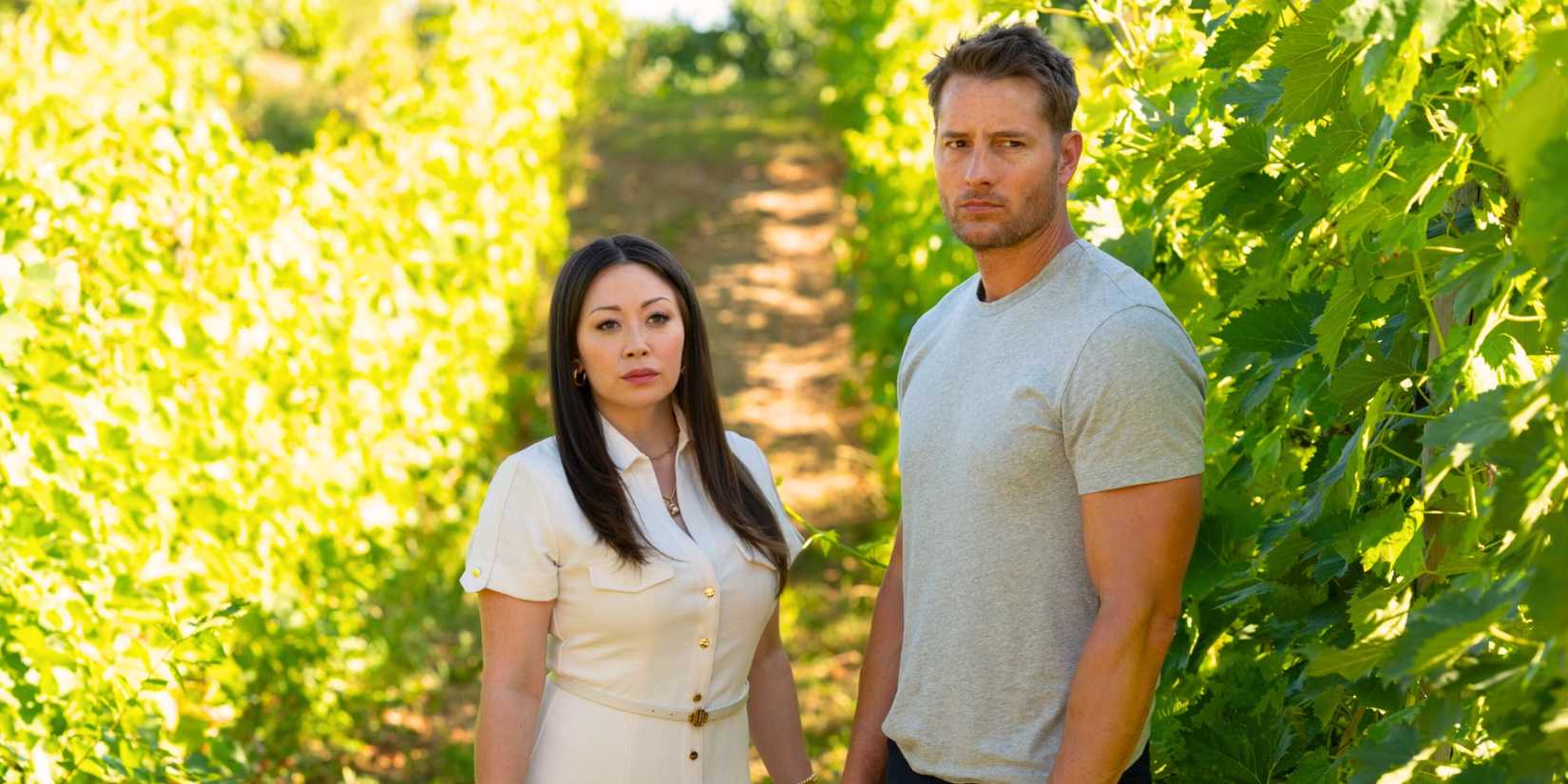 Reenie (Fiona Rene) and Colter (Justin Hartley) standing between rows of grape vines in Tracker season 2