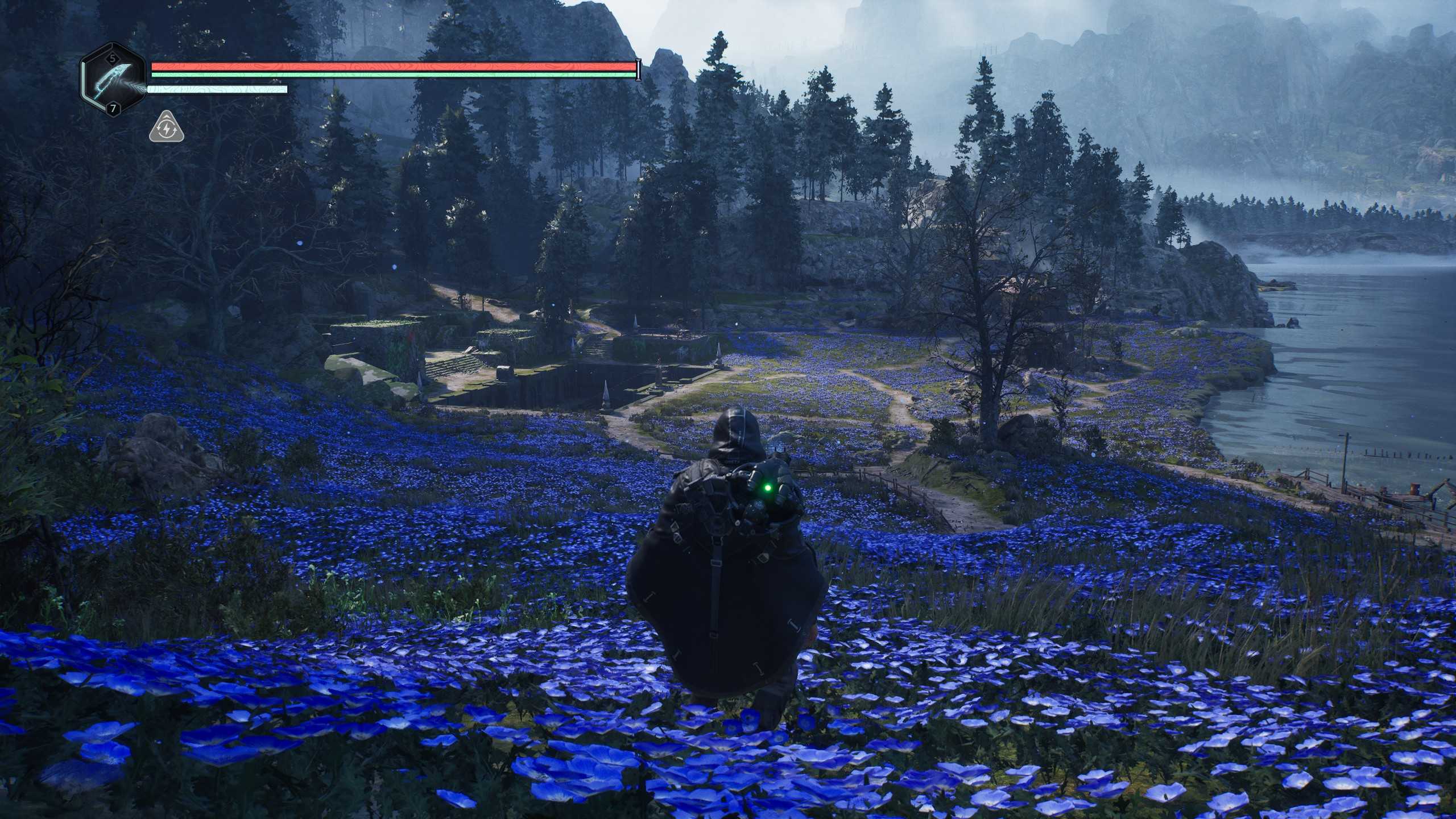 Remi stands amidst a field of indigo flowers near the shore in Hell is Us