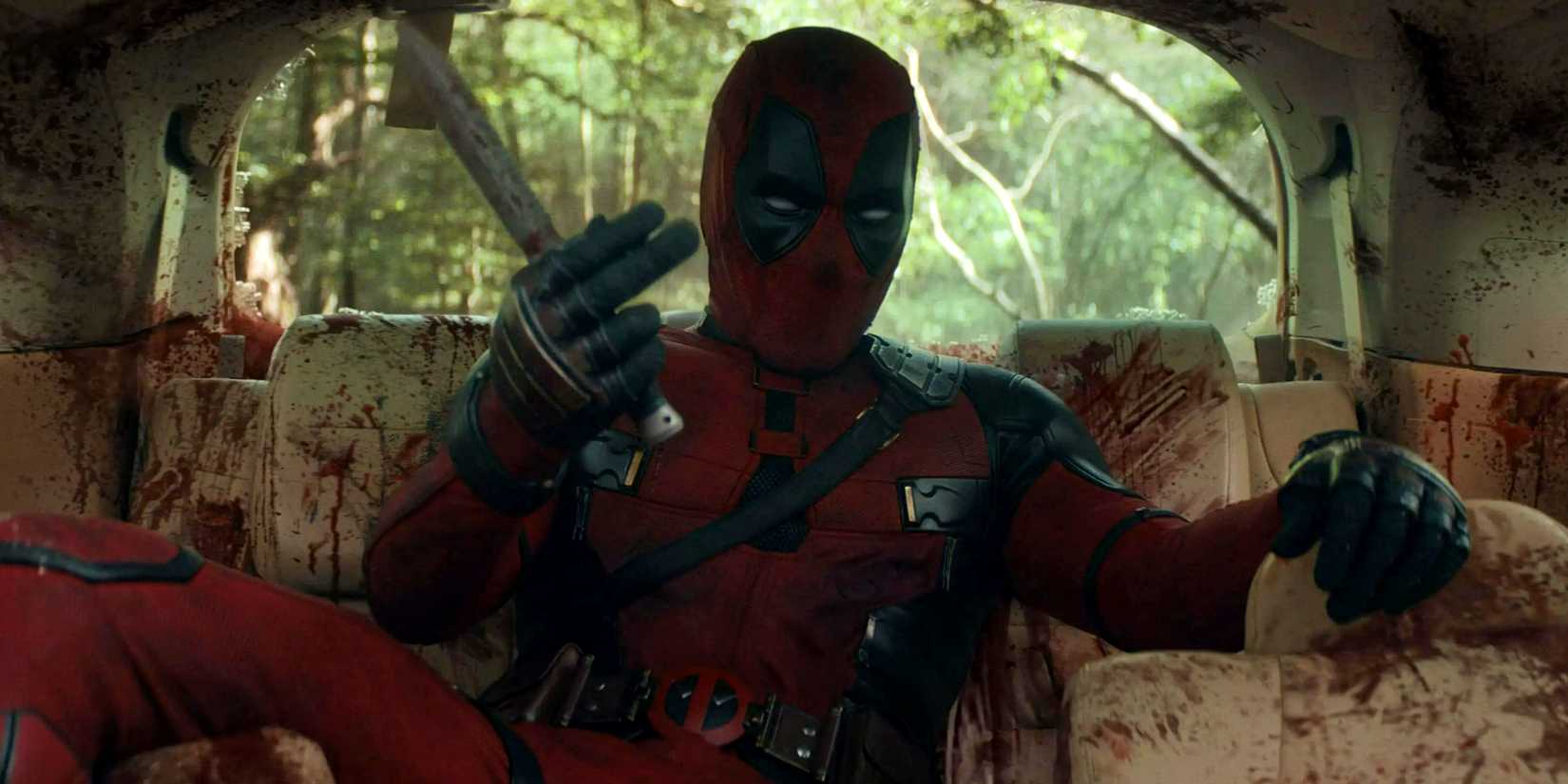 Ryan Reynolds' ᴅᴇᴀᴅpool motioning Hugh Jackman's Wolverine to fight in a car full of blood