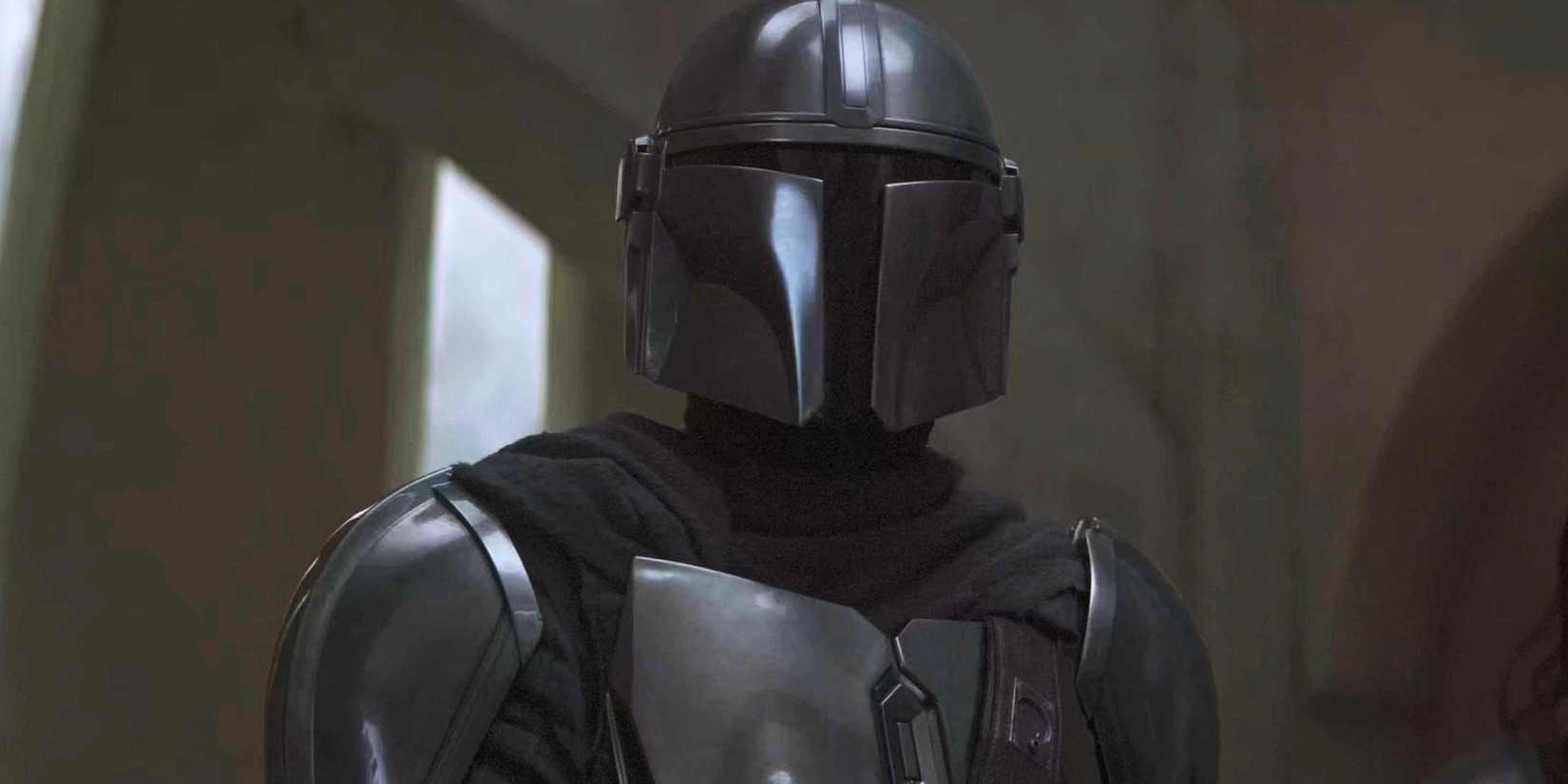 Din Djarin stares out of the Nevarro cantina after Moff Gideon's arrival.