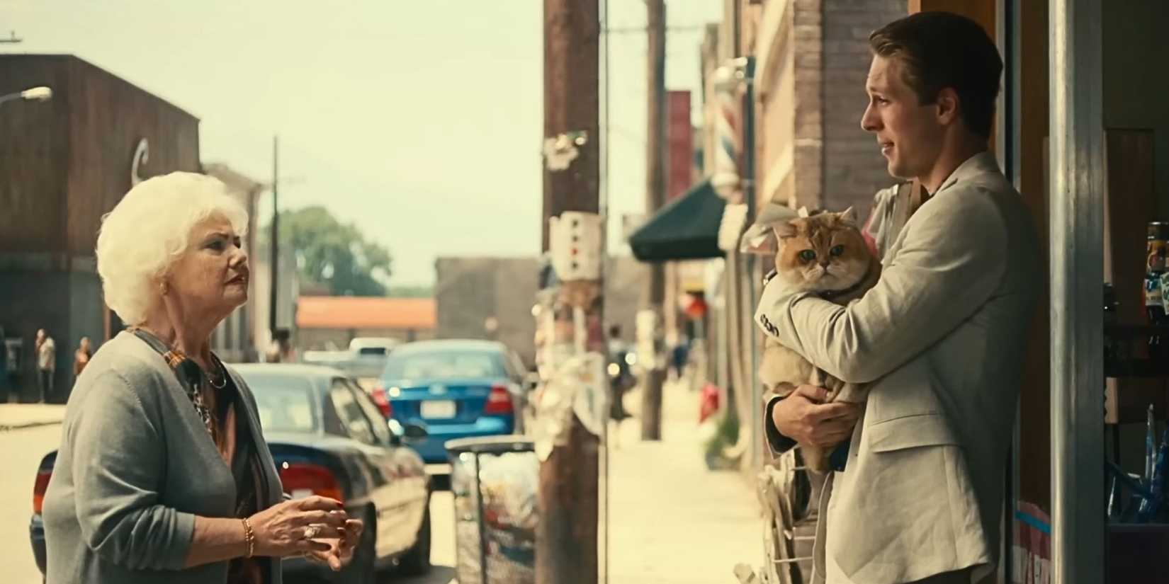 A henchman threatens Winston's neighbor in The Toxic Avenger