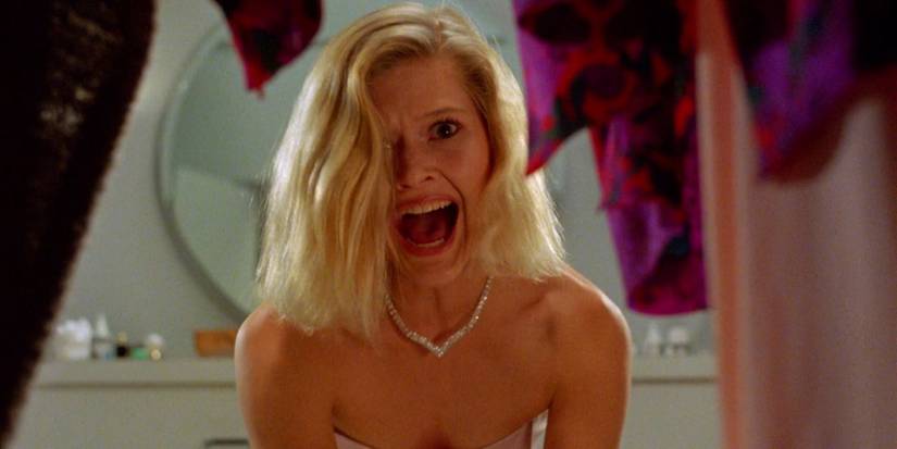 A woman screams while looking into a closet in Society