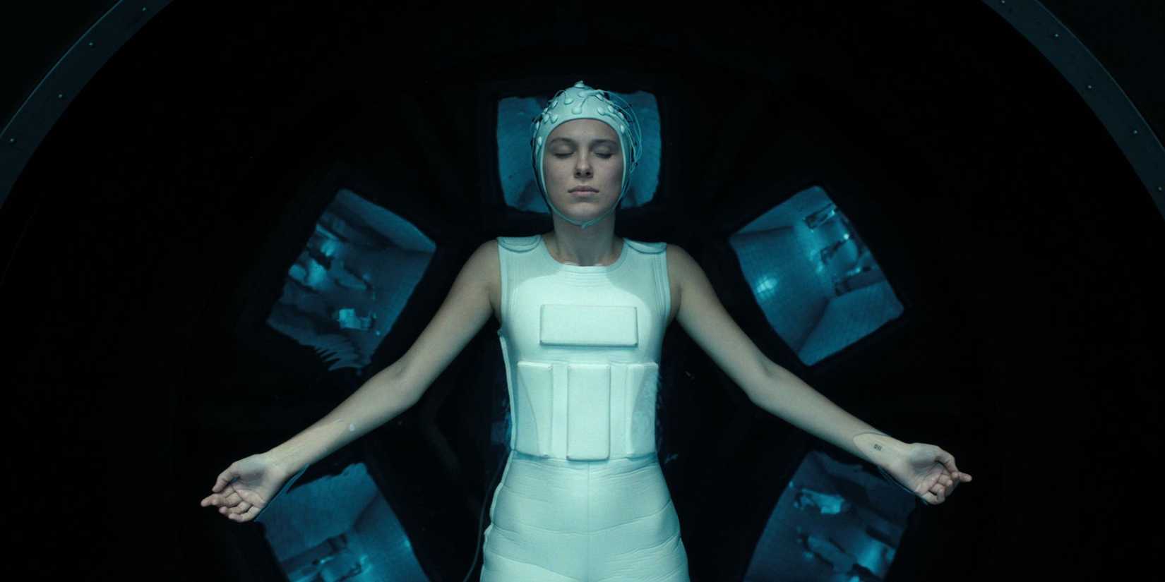 Eleven (Millie Bobbie Brown) floating in an array in Stranger Things.