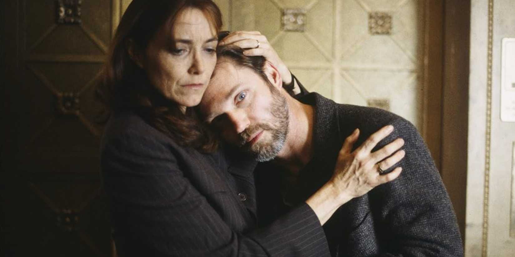 A woman comforts a sick man in the SVU episode "Scourge"