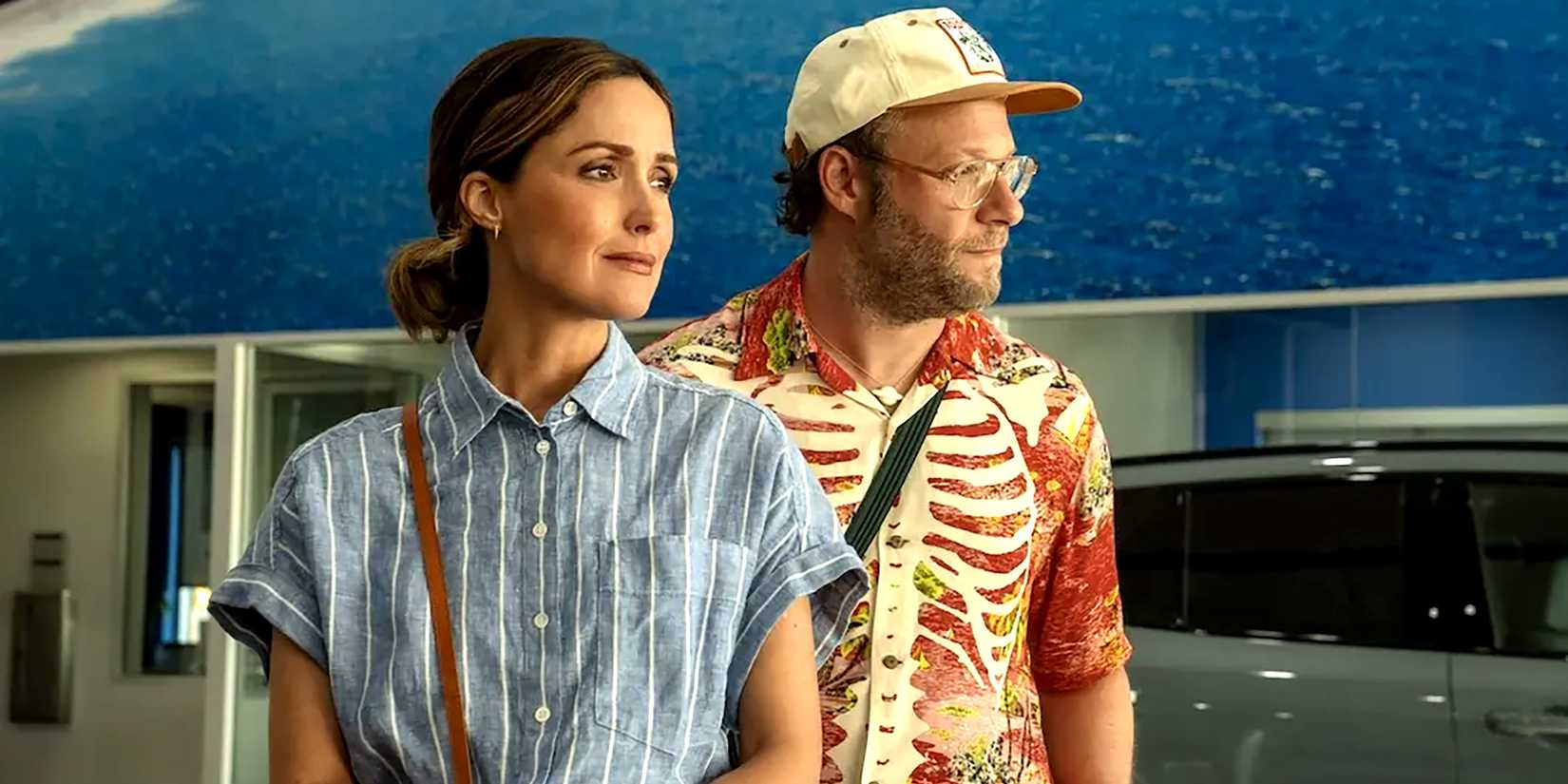 Sylvia and Will looking into the distance while standing next to each other in Platonic season 2