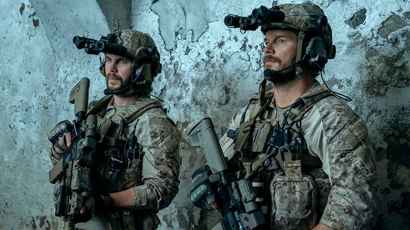 Taylor Kitsch's Ben and Chris Pratt's Reece looking stoic while in their army uniforms and holding rifles in The Terminal List: Dark Wolf YT