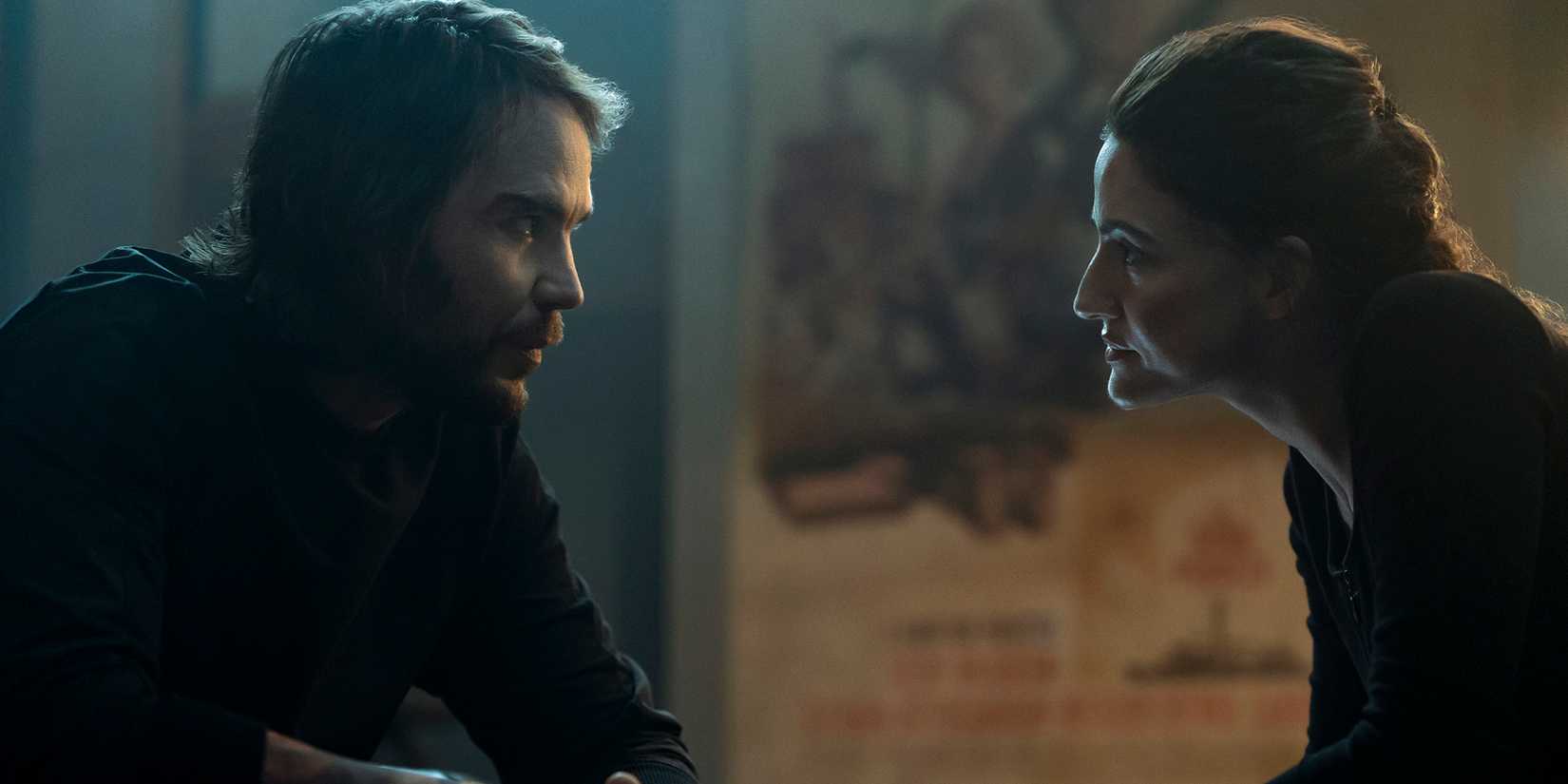Taylor Kitsch's Ben and Rona-Lee Shimon's Eliza having a conversation with their faces close in The Terminal List: Dark Wolf
