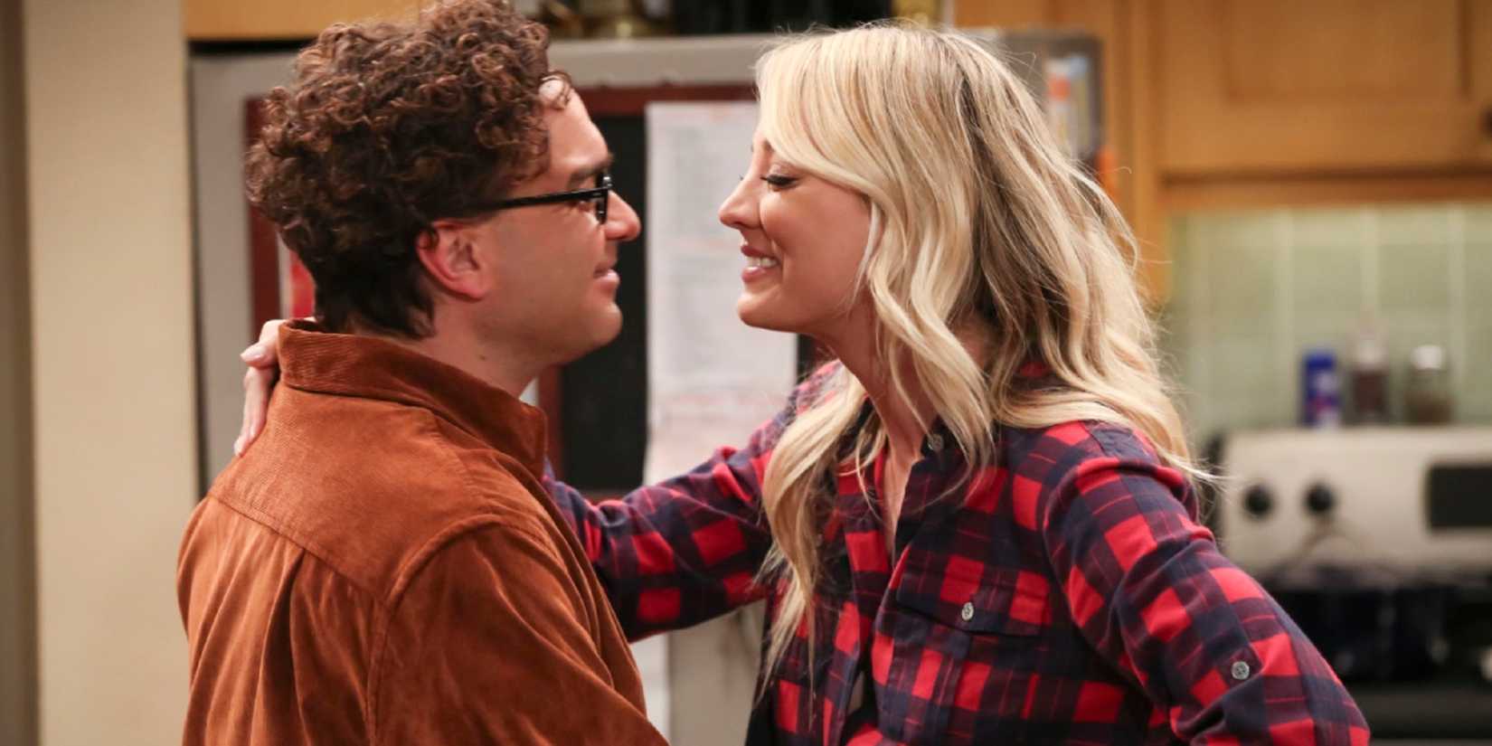 Leonard (Johnny Galecki) and Penny (Kaley Cuoco) smiling at one another in The Big Bang Theory