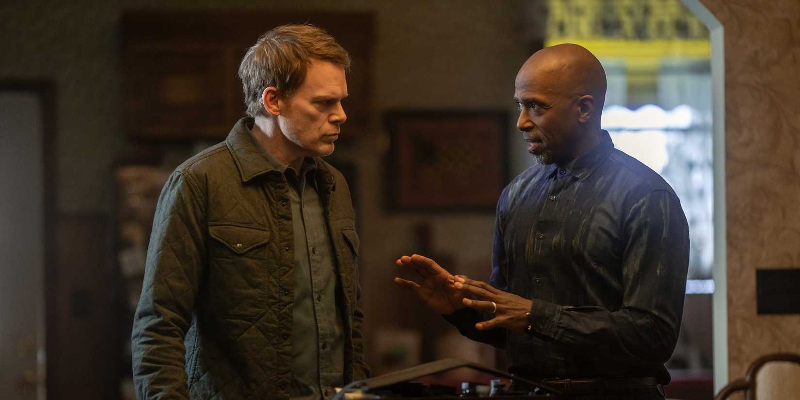 Dexter Morgan (Michael C. Hall) and Blessing Kamara (Ntare Guma Mbaho Mwine) having a tense conversation in Dexter: Resurrection season 1
