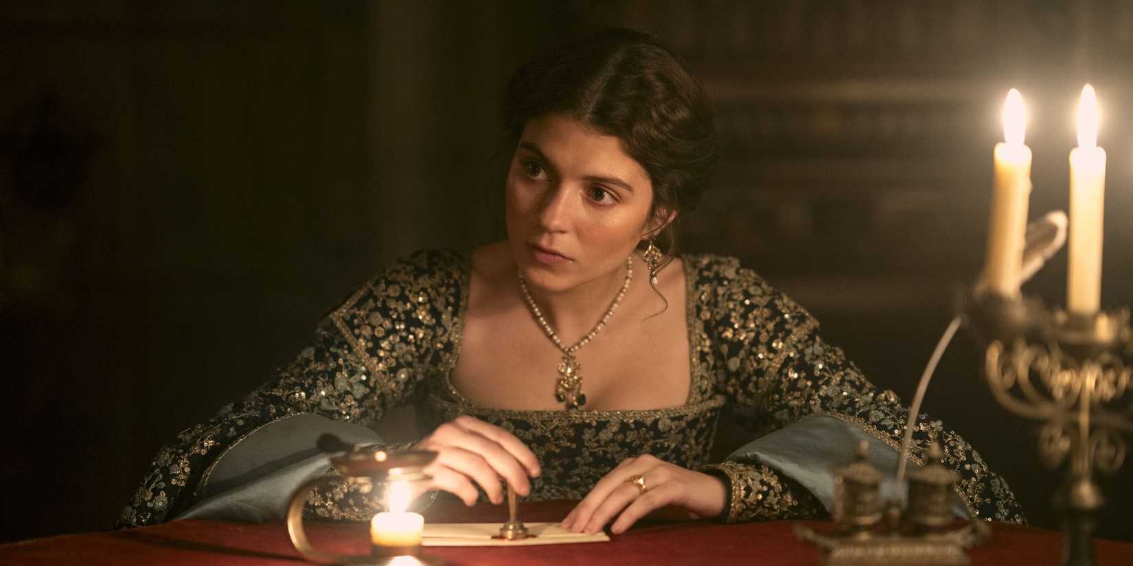 Lady Jane Grey (Emily Bader) stamping something and looking concerned in My Lady Jane.