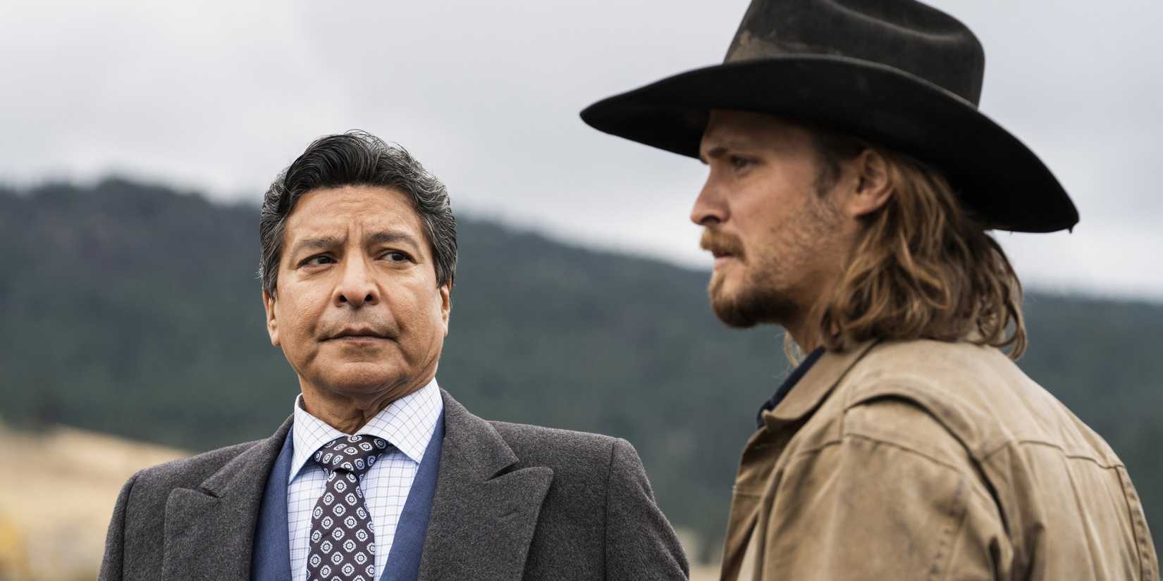 Gil Birmingham glancing at Luke Grimes in Yellowstone season 4