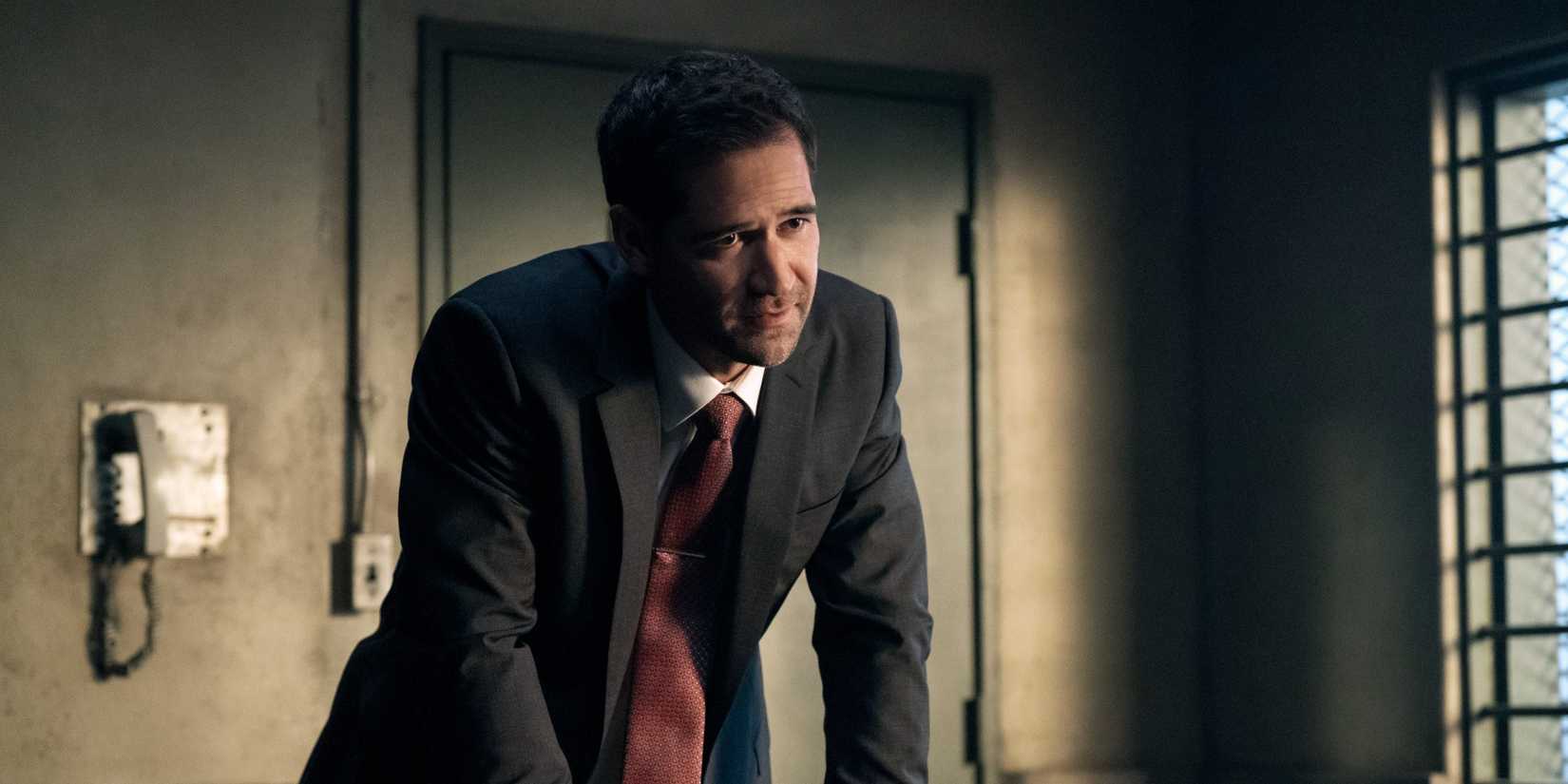 Mickey looks upset while standing in an interview room in The Lincoln Lawyer