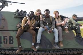 The Long Walk cast in front of a tank