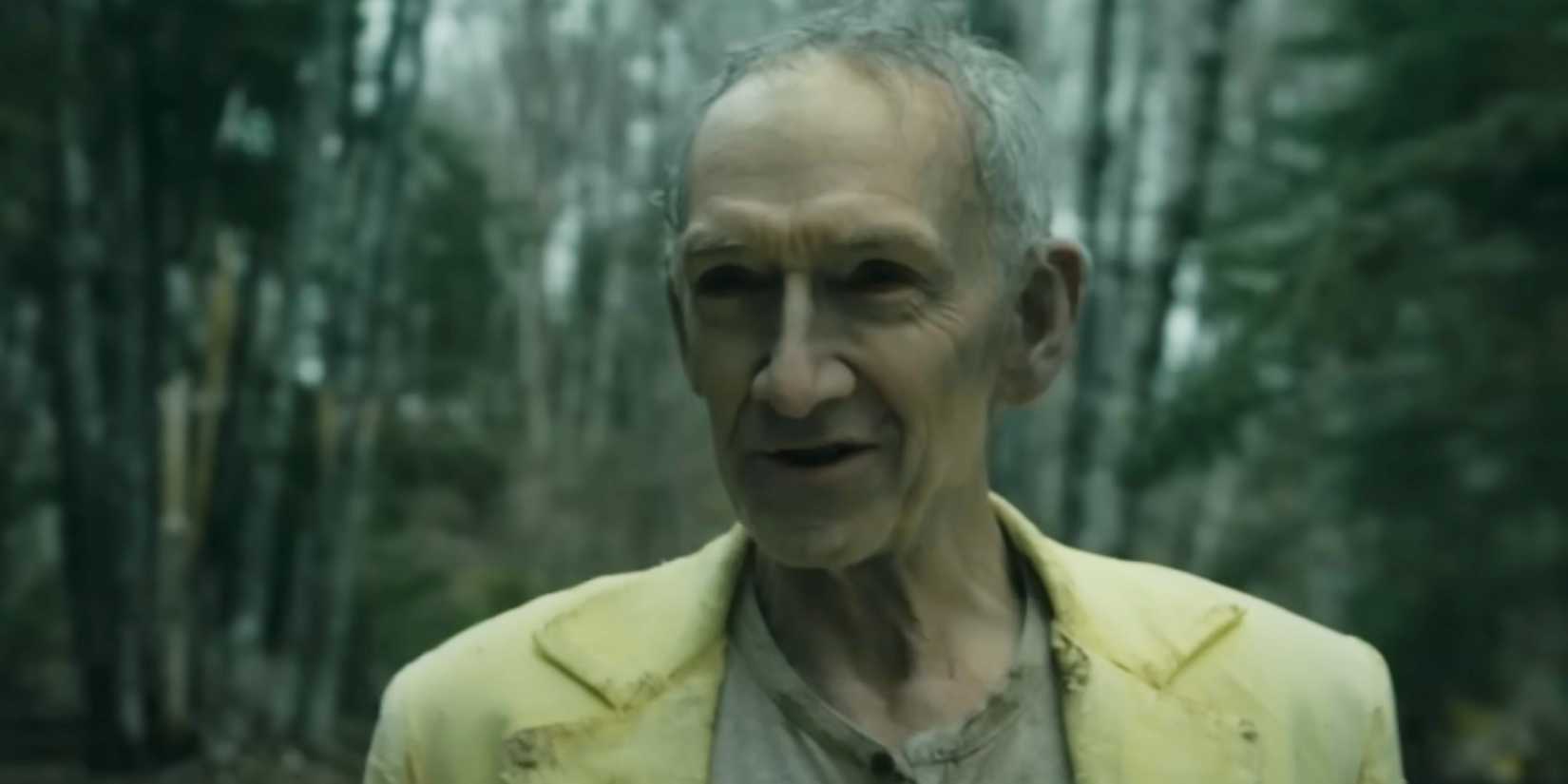 The Man in Yellow looking menacing in the woods in From season 3 finale