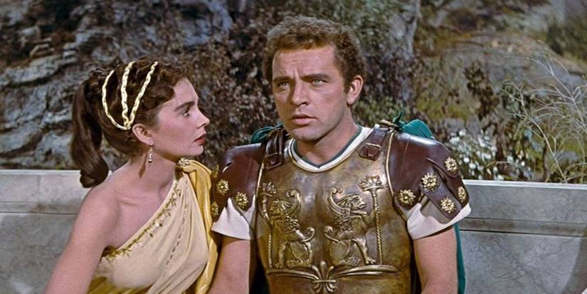Richard Burton talks to a woman while wearing armor in The Robe