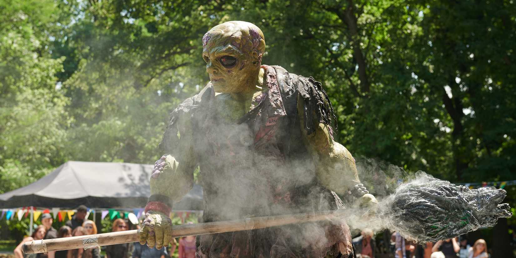 The Toxic Avenger surrounded by smoke