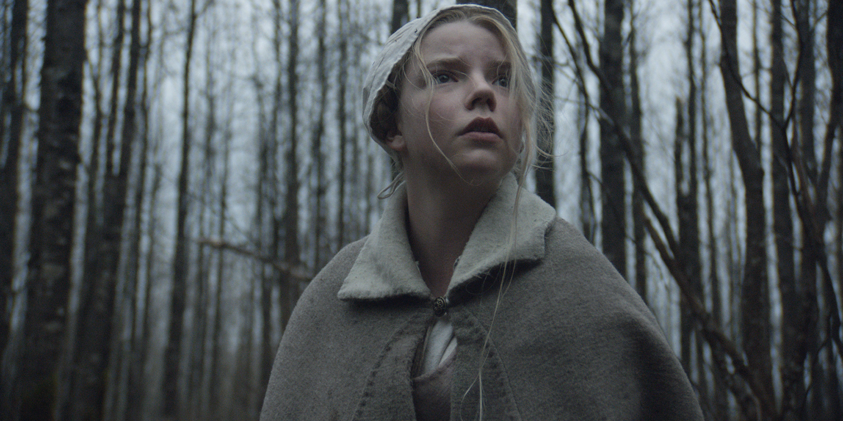 Anya Taylor-Joy as Thomasin outdoors in The Witch