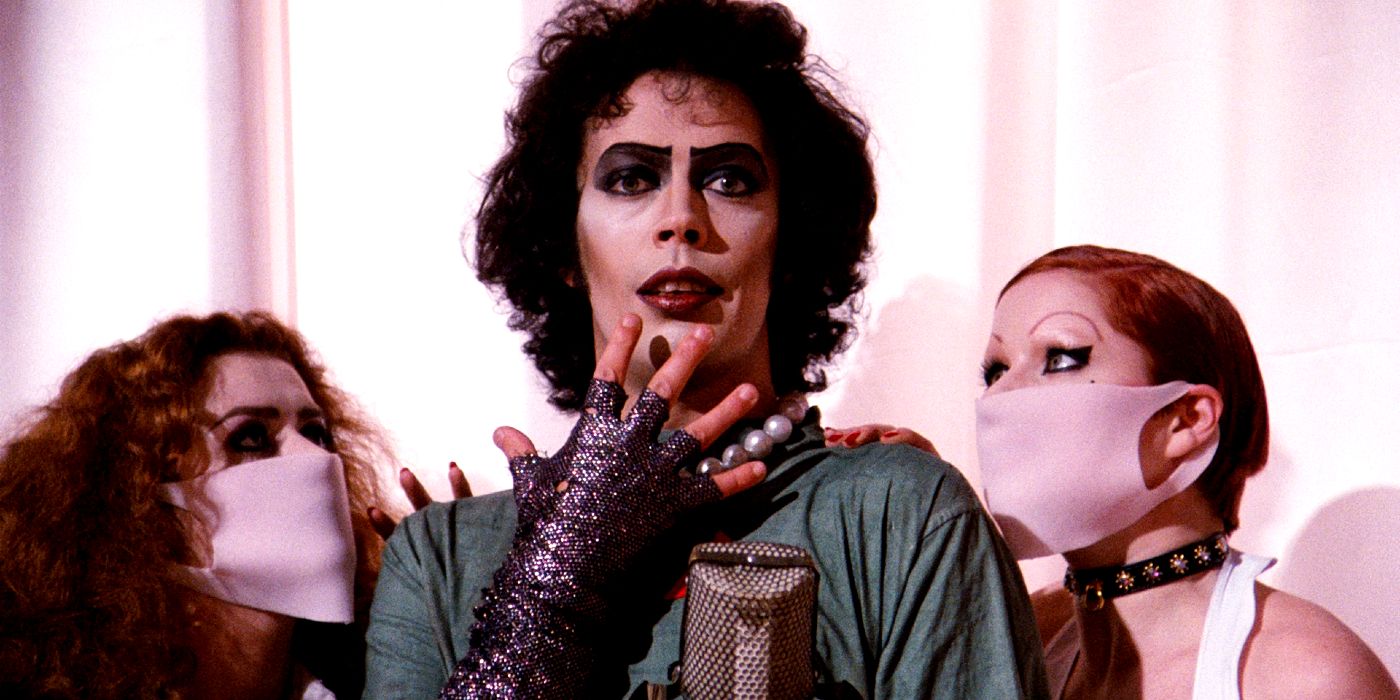 Tim Curry with two assistants in the Rocky Horror Picture Show