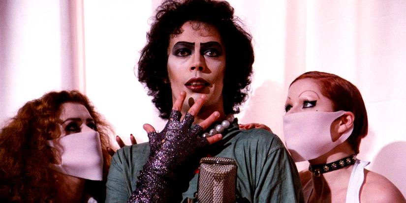 Tim Curry with two ᴀssistants in the Rocky Horror Picture Show