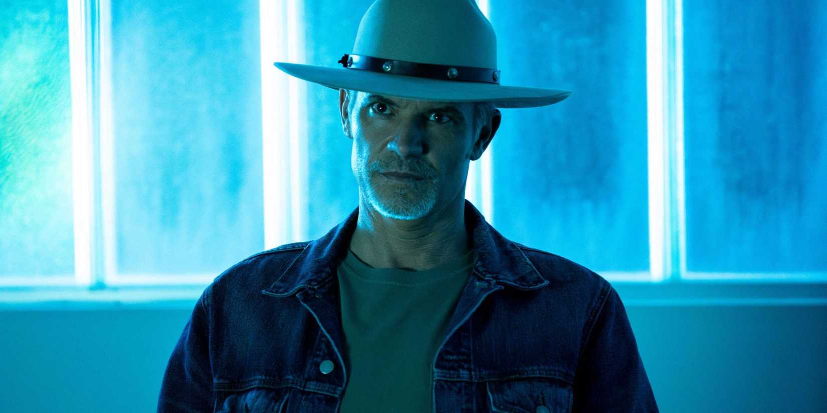 Timothy Olyphant as Raylan Givens staring menacingly in a brightly lit room, in Justified City Primeval