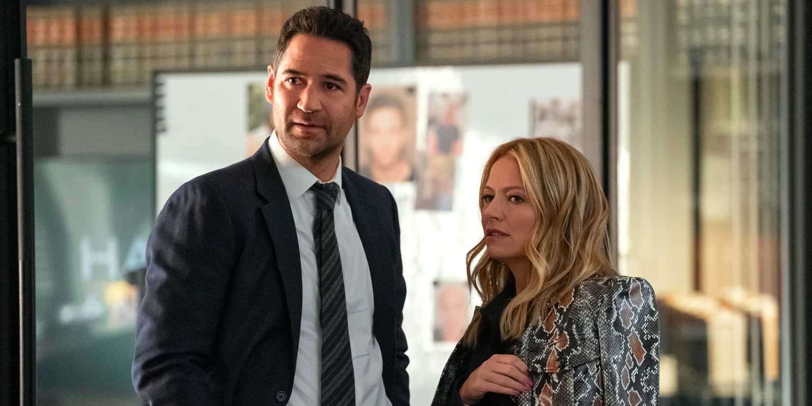 Mickey Haller, played by Manuel Garcia Rulfo, and Lorna Crane, played by Becki Newton, look to the side in The Lincoln Lawyer season 3.