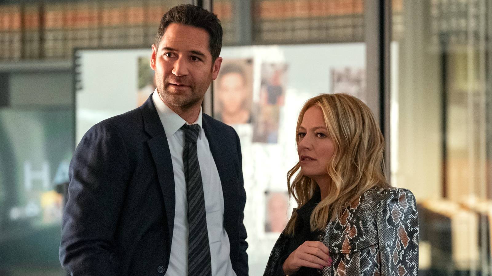Mickey Haller, played by Manuel Garcia Rulfo, and Lorna Crane, played by Becki Newton, look to the side in The Lincoln Lawyer season 3.