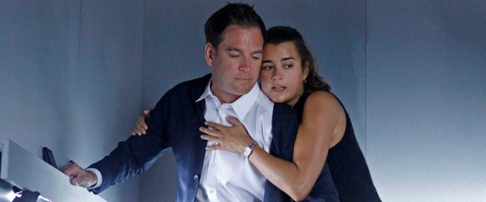 Tony (Michael Weatherly) and Ziva (Cote de Pablo) holding onto one another in a falling elevator in NCIS