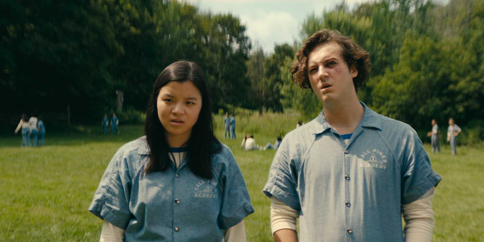 Two students at Tall Pines stand in the field in Netflixs Wayward(1)