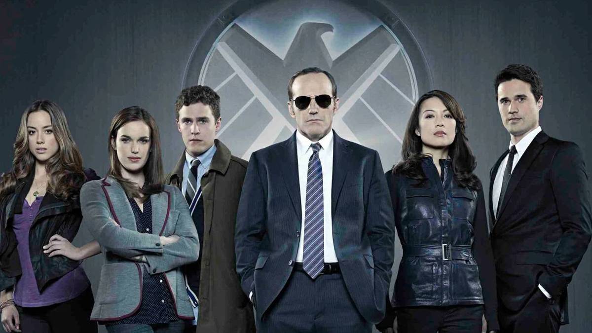 The main characters in Agents of S.H.I.E.L.D. against a grey background with the logo 